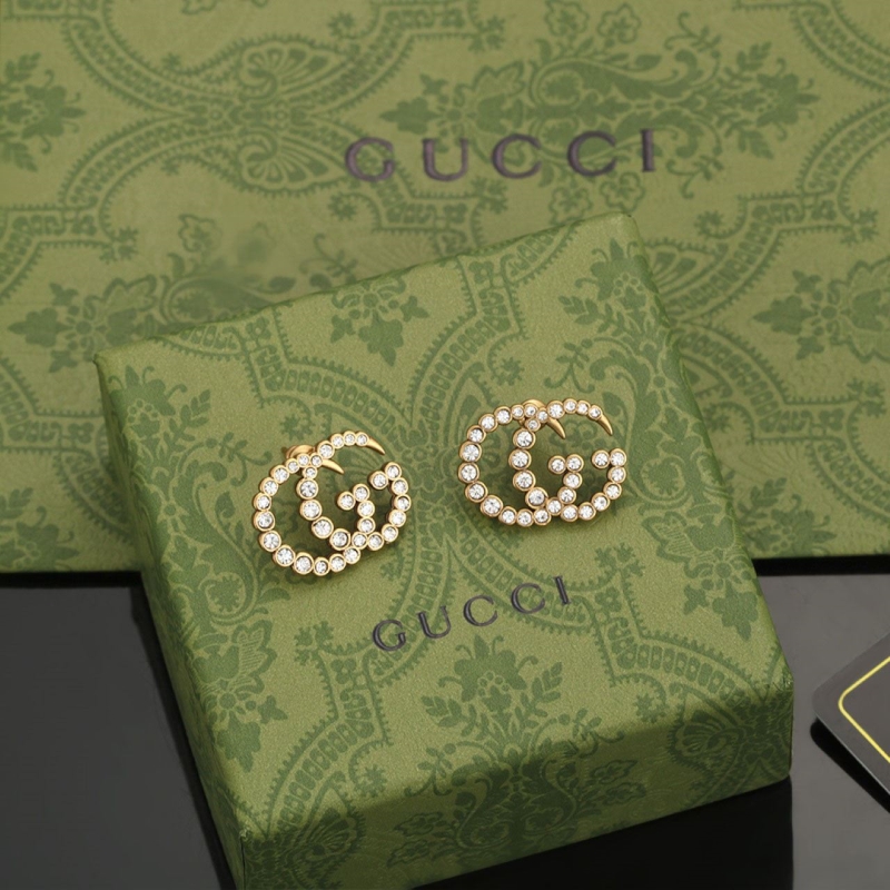 G*u*i earrings